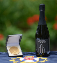 Load image into Gallery viewer, Photo of our wine by a gold medal at the Lieutenant-Governor’s Award for Excellence in Nova Scotia Wines Ceremony
